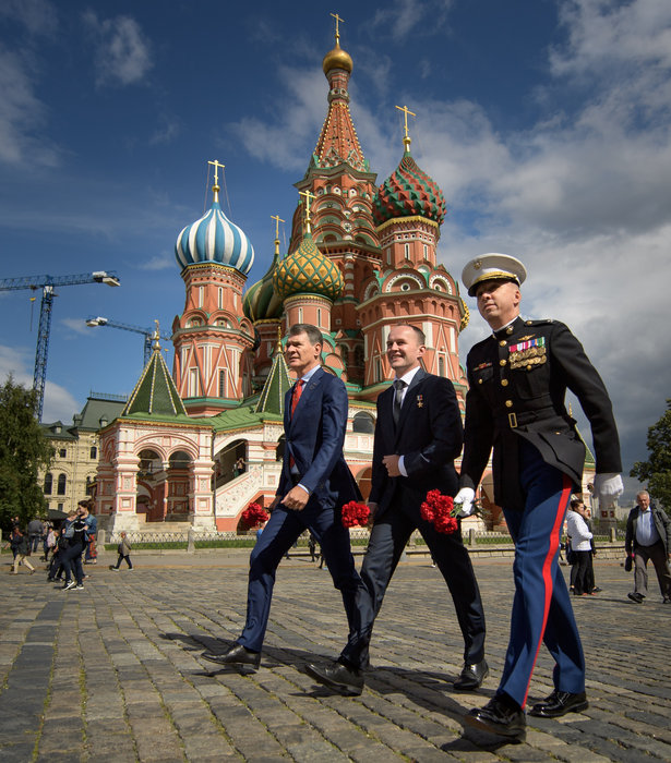 Expedition 52 flight engineers Paolo Nespoli of ESA, left, Sergey Ryazanskiy of Roscosmos, center, and Randy Bresnik of NASA visit Red Square to lay roses at the site where Russian space icons are interred as part of traditional pre-launch ceremonies, Monday, July 10, 2017 in Moscow. Photo Credit: (NASA/Bill Ingalls) 